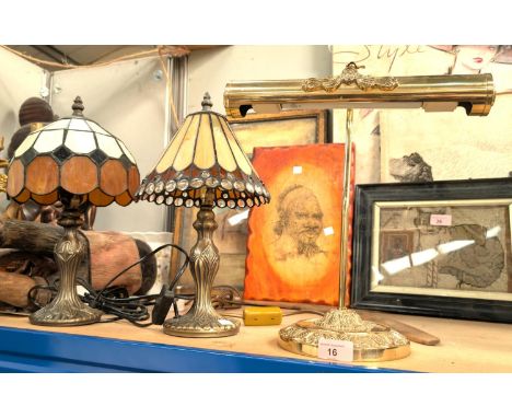 A brass library lamp and two Tiffany style lamps.
