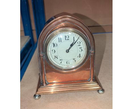 An early 20th Century copper mantle clock.
