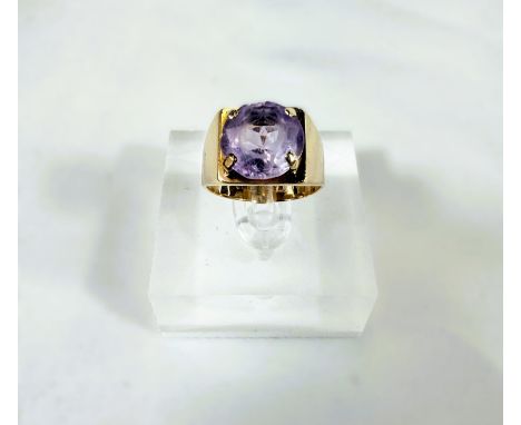 A 9ct hallmarked gold ring set with a large amethyst, 4.3gms, size K