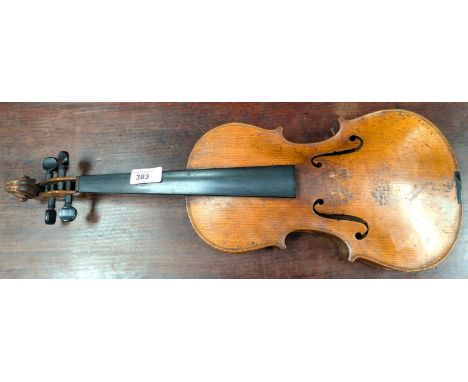 A 19th century violin with spurious label with carved academy detail to back of head, back length 35.5cm