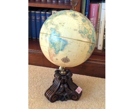 A reproduction library globe and a collection of hardback books, various subjects, Dickens etc.