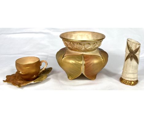 Royal Worcester - a cabinet cup in the form of a gilt potato with leaf saucer; a squat vase in peach, ivory, green and gilt a