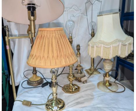 An adjustable reading&nbsp; lamp and various brass table lamps.