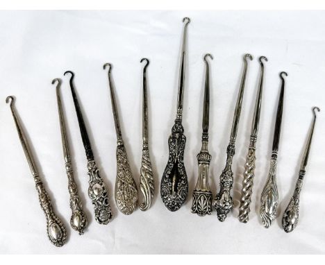 A collection of 9 silver handle button hooks, Birmingham hallmarks.