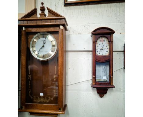 A reproduction Rapport Nelsons hat mantel clock; a Seiko Westminster Wittington wall clock and another wall clock.