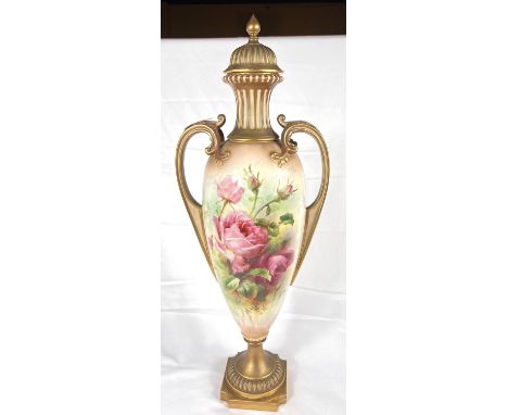 A large Royal Worcester hand-painted lidded urn vase with rose decoration on a gilt and ivory coloured background, signed Rob