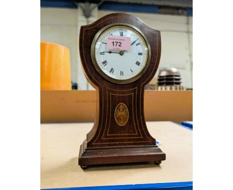 An Edwardian inlaid mahogany balloon top mantle clock.