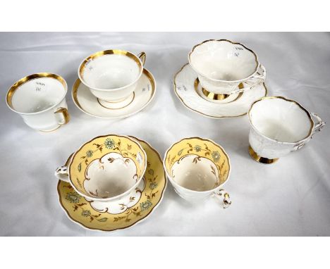 A rare Rockingham trio set with yellow, green and gilt border, saucer with puce griffin mark; and two other gilt bordered 19t