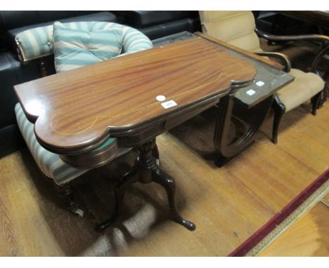 A MAHOGANY FOLD OVER CARD TABLE the rectangular shaped moulded hinged top containing baize lined interior raised on a baluste