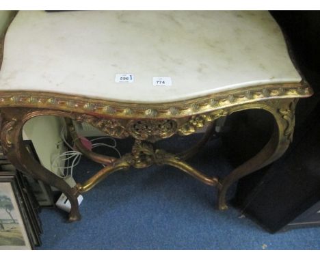 A GOOD CONTINENTAL GILTWOOD CONSOLE TABLE c.1900 surmounted with white vein marble top above a foliate carved frieze on cabri