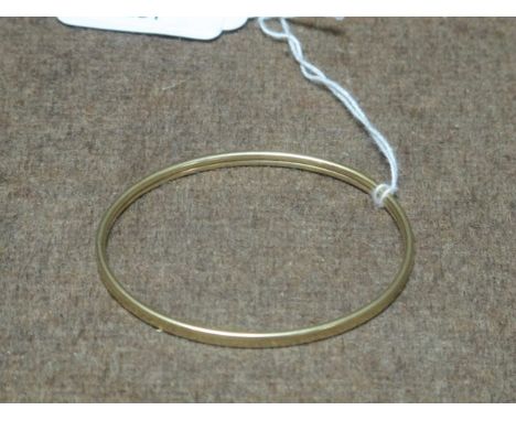 A 9CT GOLD BANGLE