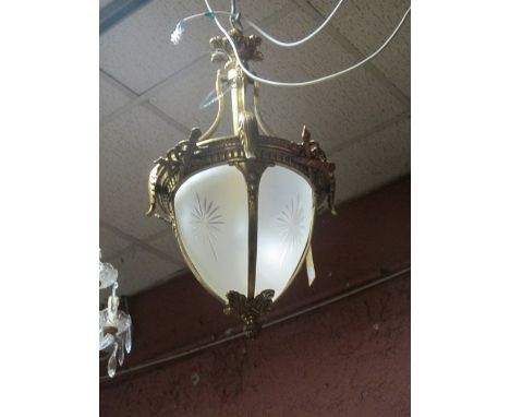 A CONTINENTAL GILT BRASS CENTRE LIGHT with cut glass panels and reeded column with moulded arms