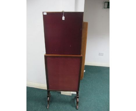 A GEORGIAN MAHOGANY FIRESCREEN of rectangular outline with sliding panels raised on standard end supports with splayed legs 1