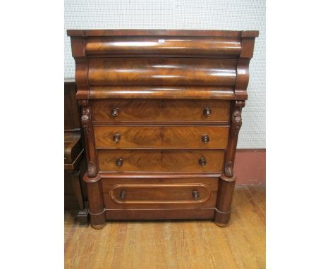 A GOOD VICTORIAN MAHOGANY SCOTCH CHEST of inverted breakfront outline the shaped moulded top above six long graduated drawers