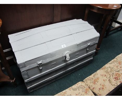 A CABIN TRUNK of rectangular dome form together with an Edwardian mirrored wall bracket and a cast iron stick stand copper li