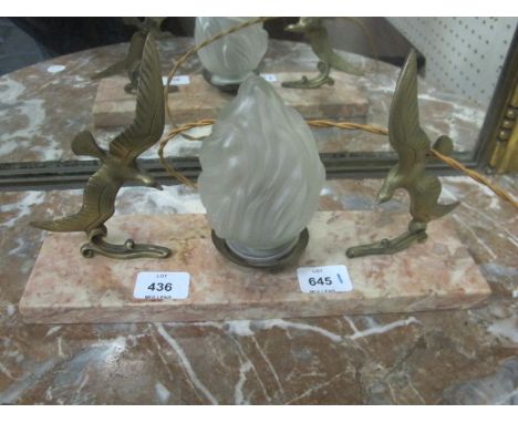 A MARBLE AND BRASS TABLE LAMP with flame shade flanked on each side with birds in flight raised on a marble base 18cm x 34cm 