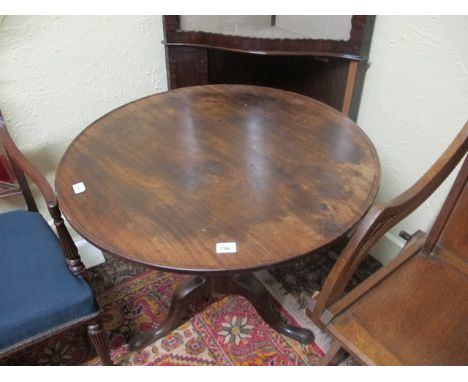 A GEORGIAN MAHOGANY SNAP TOP TABLE the circular dish top above a baluster column on tripod support with pad feet 84cm x 71cm