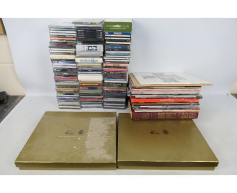 A quantity of compact discs and vinyl records to include Motown, Barry White, The Bee Gees and other. [2]
