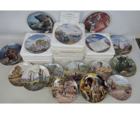 A quantity of military related and other Danbury Mint collector plates.