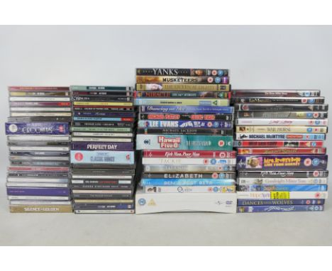 A collection of compact discs and a quantity of DVDs. [2]