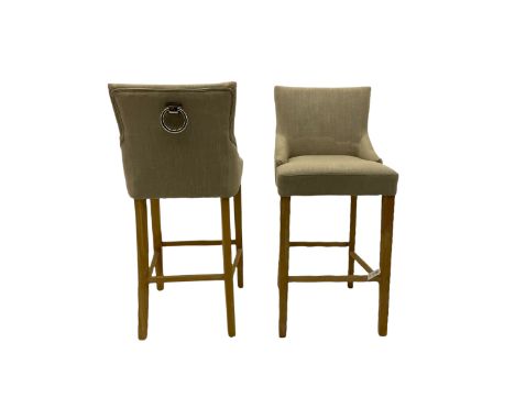 Pair of light oak bar stools, upholstered in beige fabricDimensions: Height:&nbsp;112cm&nbsp; Length/Width:&nbsp;52cm&nbsp; D