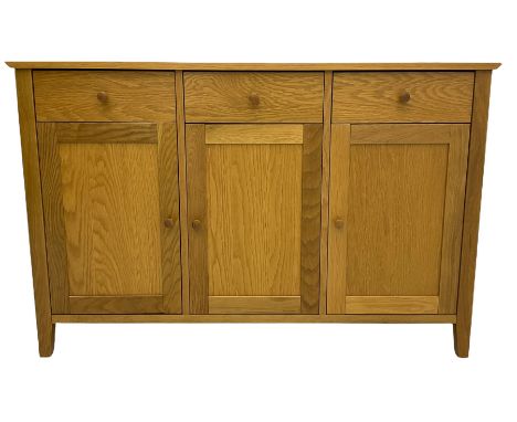 Light oak finish sideboard, fitted with three drawers and cupboardsDimensions: Height:&nbsp;80cm&nbsp; Length/Width:&nbsp;124