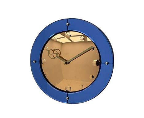 A Smiths 'Venus' Art deco electric wall clock with a convex peach and cobalt mirror dial, with etched circular numerals and s