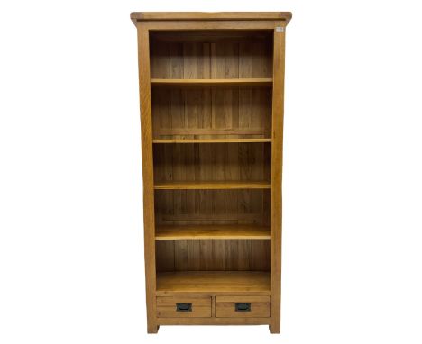 Light oak open bookcase, fitted with two drawersDimensions: Height:&nbsp;190cm&nbsp; Length/Width:&nbsp;89cm&nbsp; Depth/Diam