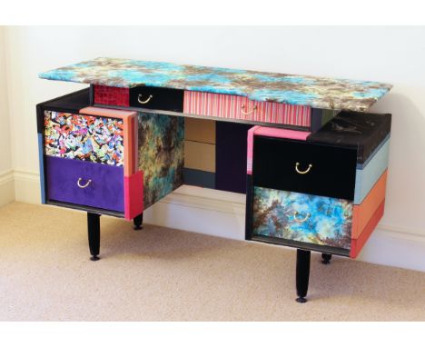 A large console table by Lisa Whatmough of Squint Limited - based on a retro 1960s side cabinet, now decorated with panels of