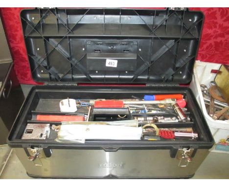 A metal tool box and contents