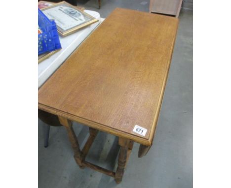 A large light oak gateleg table