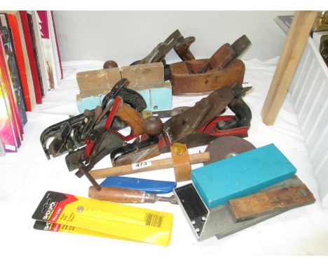 A collection of tools including old planes