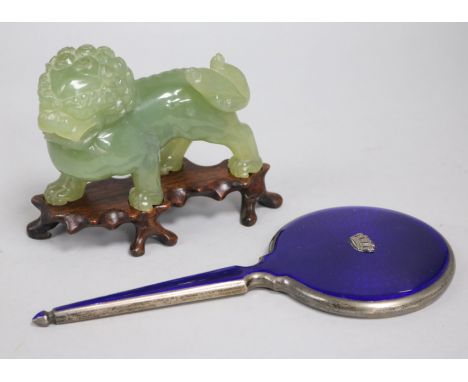 A hardstone Chinese lion and enamel mirror