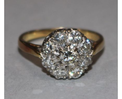 A diamond cluster ring, 18ct yellow gold shank, size K.