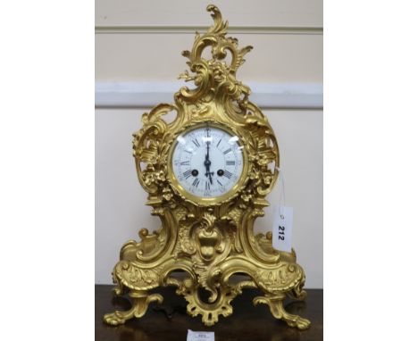 A Louis XV style gilt brass eight day mantel clock