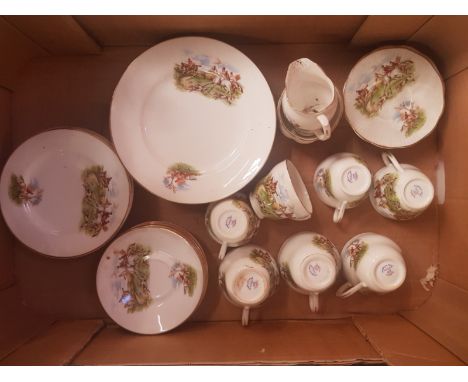 Jubilee china tea and coffee ware in a hunting theme pattern to include 6 side plates, 6 tea saucers, 6 coffee saucers, 4 cof