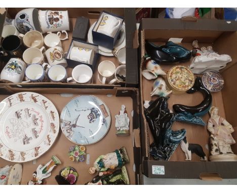 A mixed collection of ceramic items to include Poole pottery dolphin and whale figures, floral fancies, Royal and Coal mining