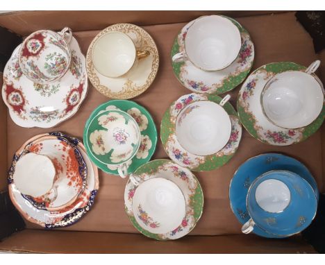 A collection of tea ware items to include 4 paragon rockingham cups and saucers, Aynsley green floral cup and saucer, Coalpor