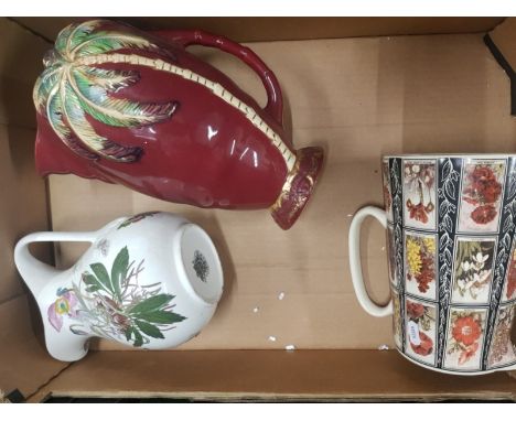 A mixed collection of Jugs to include Portmerion botanic garden jug, large beswick ware palm tree jug and 1 floral jug (1 tra