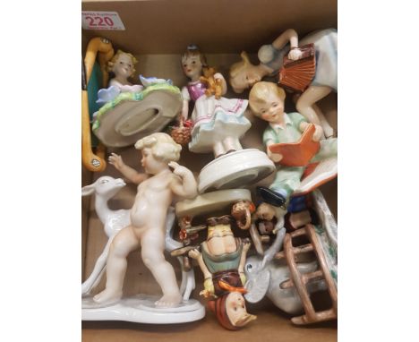 A collection of eight Goebel figures to include Boy Reading Book F218, Girl with Accordian FF217, Child with Faun, Just Resti