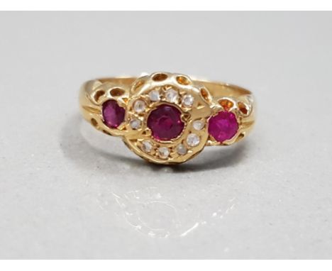 18CT YELLOW GOLD RUBY AND DIAMOND RING FEATURING 3 ROUND CUT RUBY'S WITH THE CENTRE STONE SURROUNDED BY DIAMONDS SIZE H 1.6G 