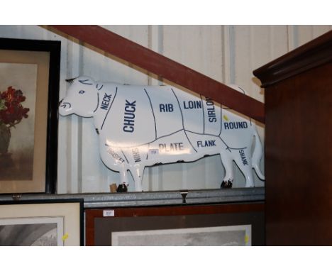 An enamel cow sign