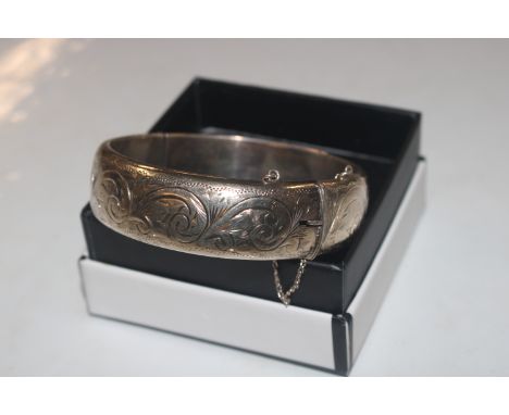 A 1961 Birmingham silver Harrods Stores Ltd bangle approx. 40gms 