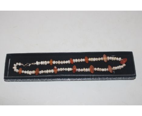 A freshwater pearl and amber necklace 