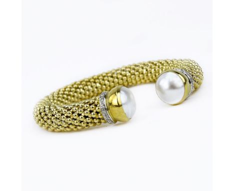 Italian 14 Karat Yellow Gold Flexible Cuff Bangle with Mabe Pearl and Diamond Accents. Stamped Italy, 14K, hallmark. Very goo