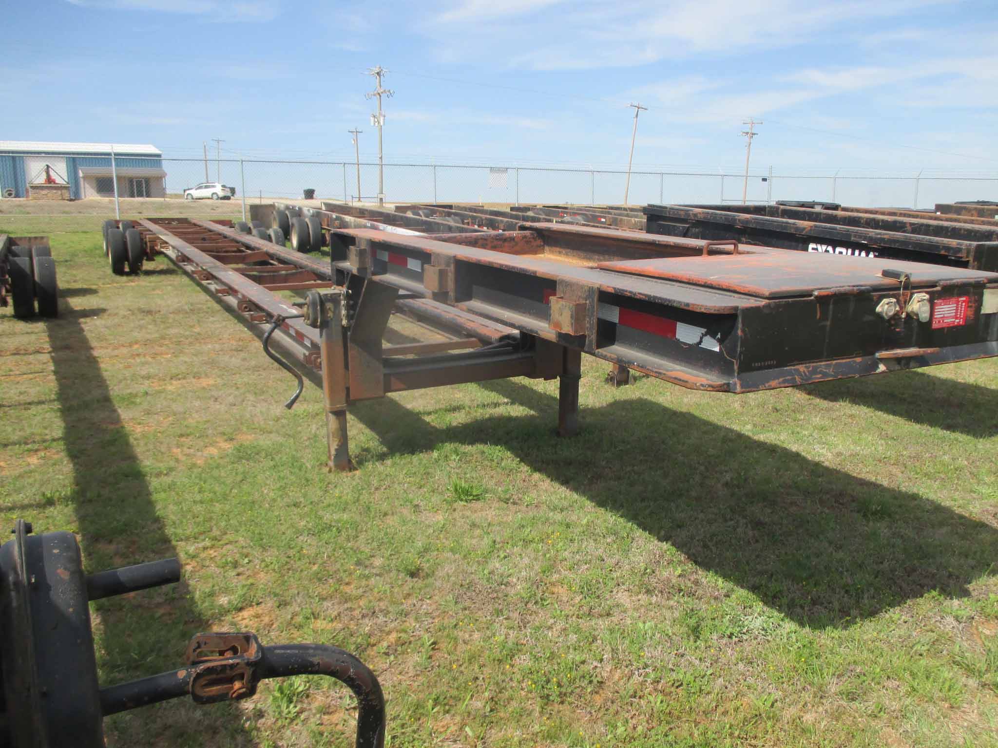 { Choice of lots 110 } } LOWBOY TANK HAULING TRAILER, 2010 CUSTOM 60