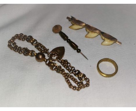 An Edwardian double belcher link bracelet with 9 carat heart lock; a bar brooch formed from 3 sharks teeth; a stick pin set w