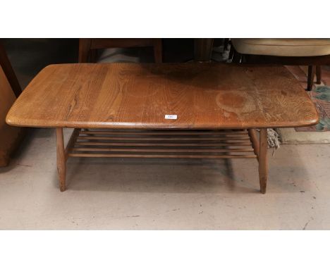 An Ercol light elm coffee table with rectangular top and undertier 