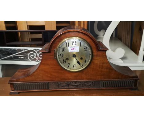 A 1920's striking mantel clock in walnut arch top case 