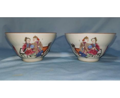 A Chinese pair of ceramic tea bowls with polychrome decoration, marks to base 